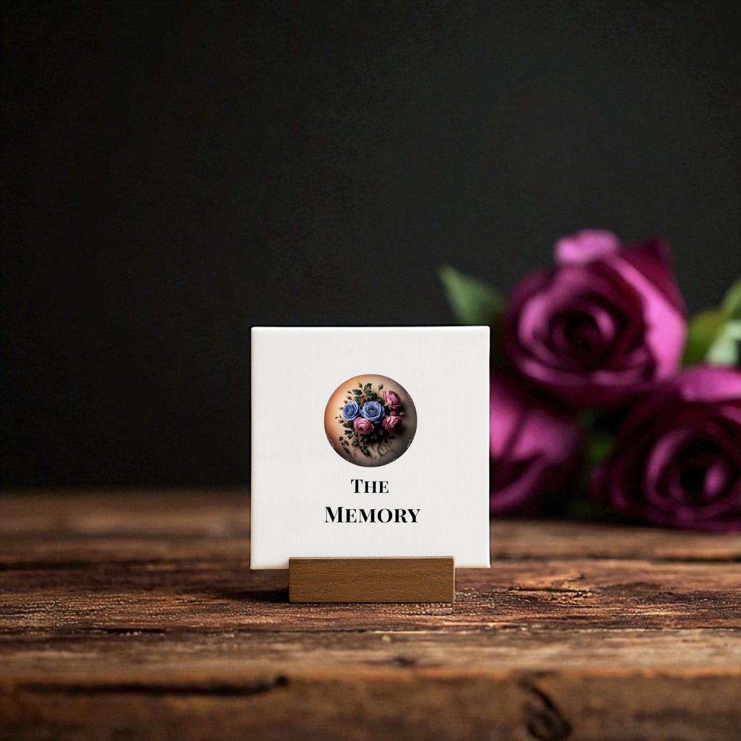 The "Mini Gothic Sign | The Memory | Dead Regency Floral" by Mirabilia Boutique is a small square plaque on a wooden stand featuring colorful gears, flowers, and two purple roses—a unique remembrance gift and gothic room decor accent.