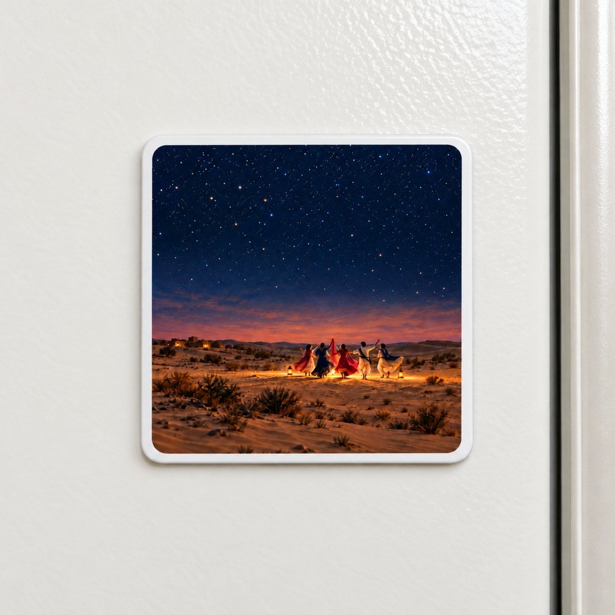 The Night We Danced Magnet by Mirabilia Boutique is a square Rajasthan artwork piece featuring a group of people dancing in a circle in the desert under a starry night sky.