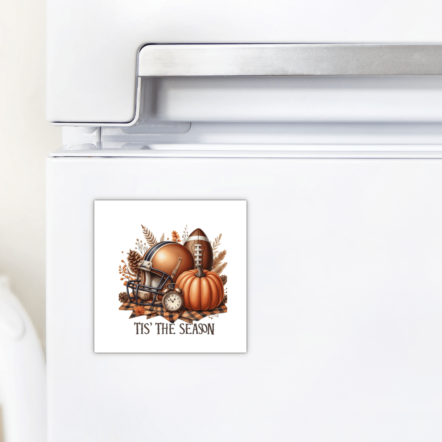 The Mirabilia Boutique Tis’ the Season Magnet features a football helmet, pumpkin, leaves, and clock with “'TIS' THE SEASON” text—ideal fall football pumpkin decor for your fridge.