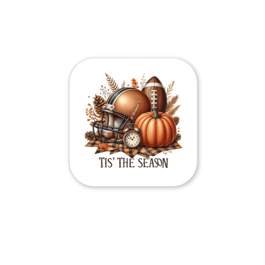 The Tis’ the Season Magnet by Mirabilia Boutique features a football helmet, football, pumpkin, autumn leaves, and a clock above the phrase “‘TIS THE SEASON”—ideal fall football or Thanksgiving fridge decor.