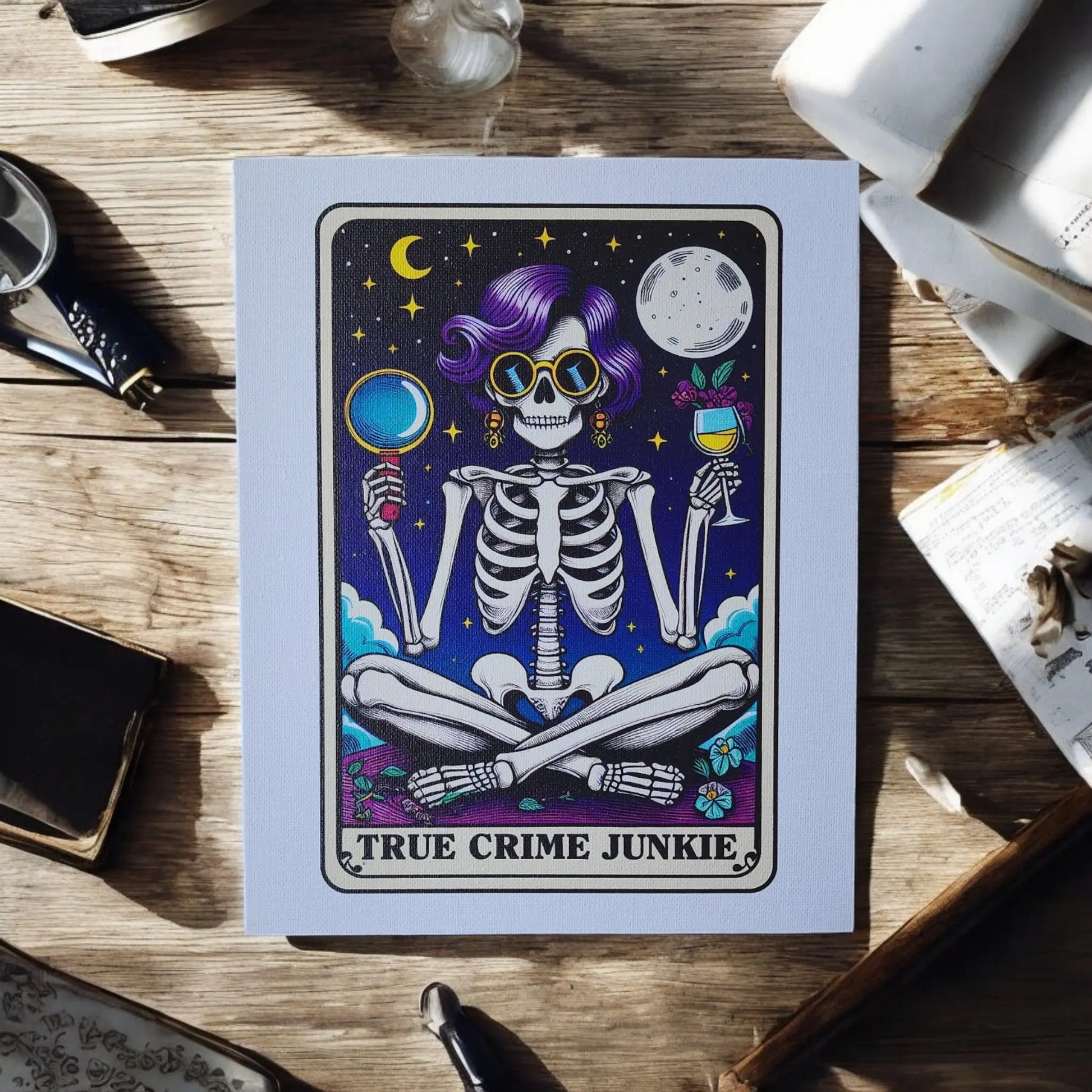 The True Crime Junkie Funny 8x10 Canvas Sign by Mirabilia Boutique features a skeleton with purple hair, wearing sunglasses, holding a magnifying glass in one hand and a glass of wine in the other. The background shows stars, a crescent moon, and a full moon. The text at the bottom reads "TRUE CRIME JUNKIE," making it perfect true crime decor.