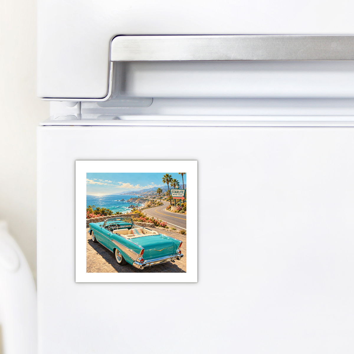 The Road Opens Magnet | Chrome & Starlight is a square convertible car magnet on a white refrigerator featuring a teal vintage car parked overlooking a coastal highway with a “Starlite Motor Court” sign.