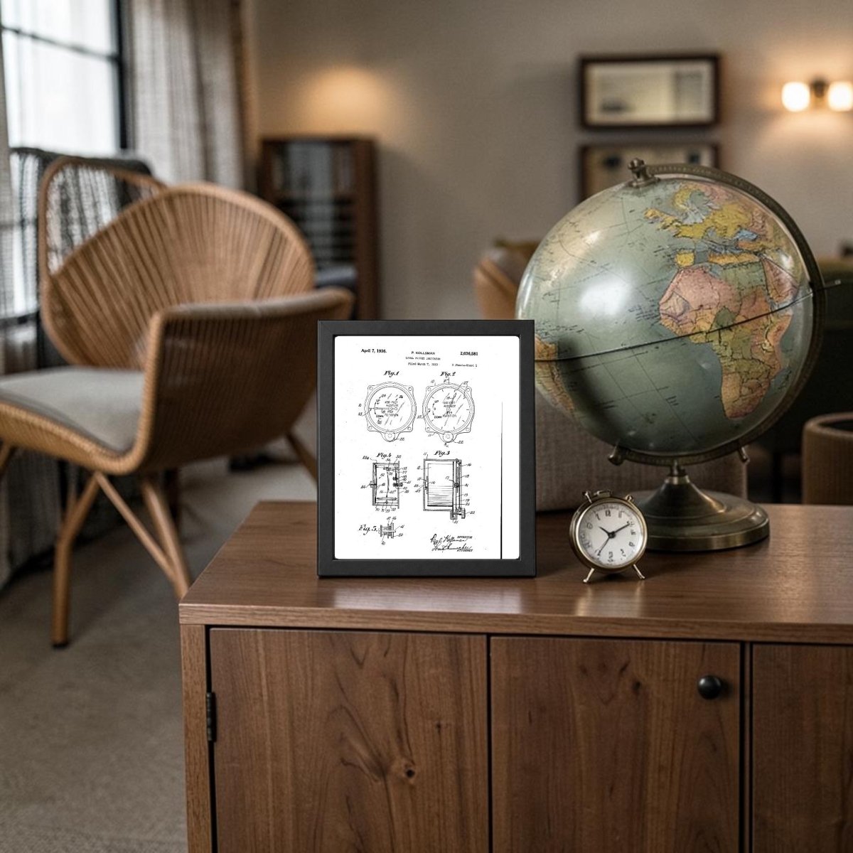 A Level Flight Indicator Patent Art Print by Mirabilia Boutique is displayed on a wooden cabinet beside a globe and small clock in a cozy, well-lit room featuring wicker furniture and neutral decor.