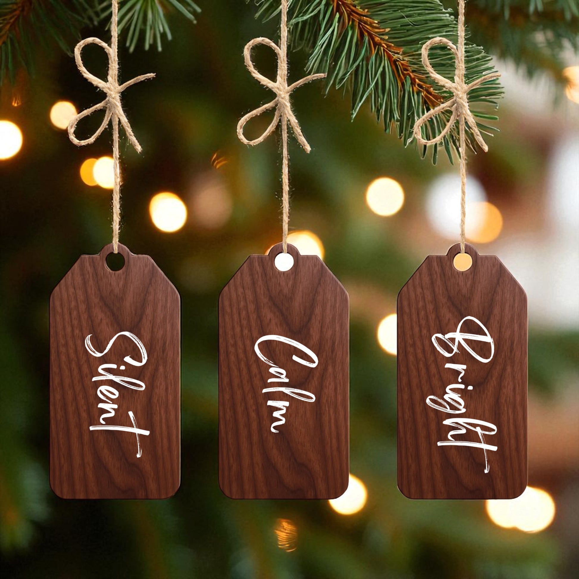 The Walnut Holiday Tags Set by Mirabilia Boutique features “Silent,” “Calm,” and “Bright” walnut ornaments, each tied with twine bows—perfect minimalist Christmas decor for a festive, cozy touch.