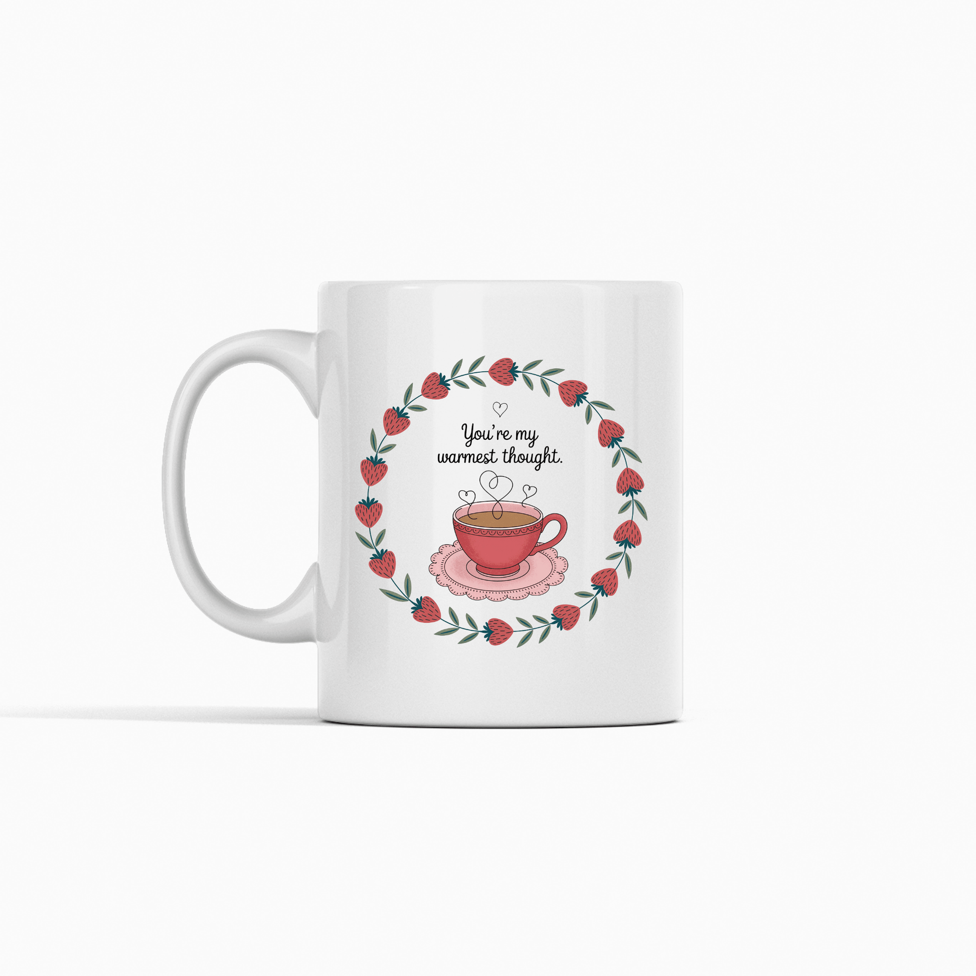 The Warmest Thought Mug – Sweet Teacup Gift Mug by Mirabilia Boutique is a white ceramic mug with a rose-hued teacup, heart-shaped steam, red flowers, and the text "You're my warmest thought" above the cup.