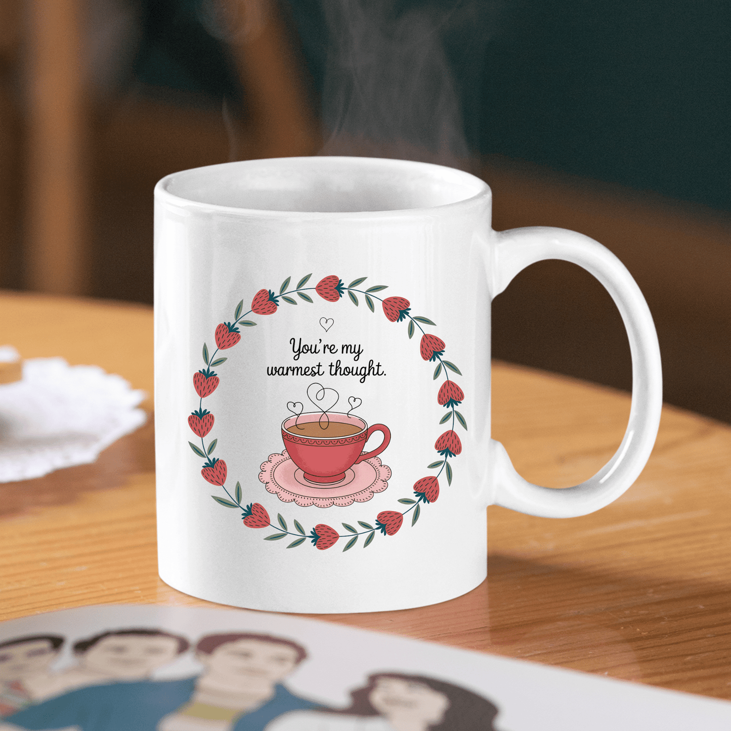 The Warmest Thought Mug – Sweet Teacup Gift Mug by Mirabilia Boutique features strawberry blossoms, a leaf border, and a steaming teacup with “You’re my warmest thought.” This ceramic mug is perfect for heartfelt moments.