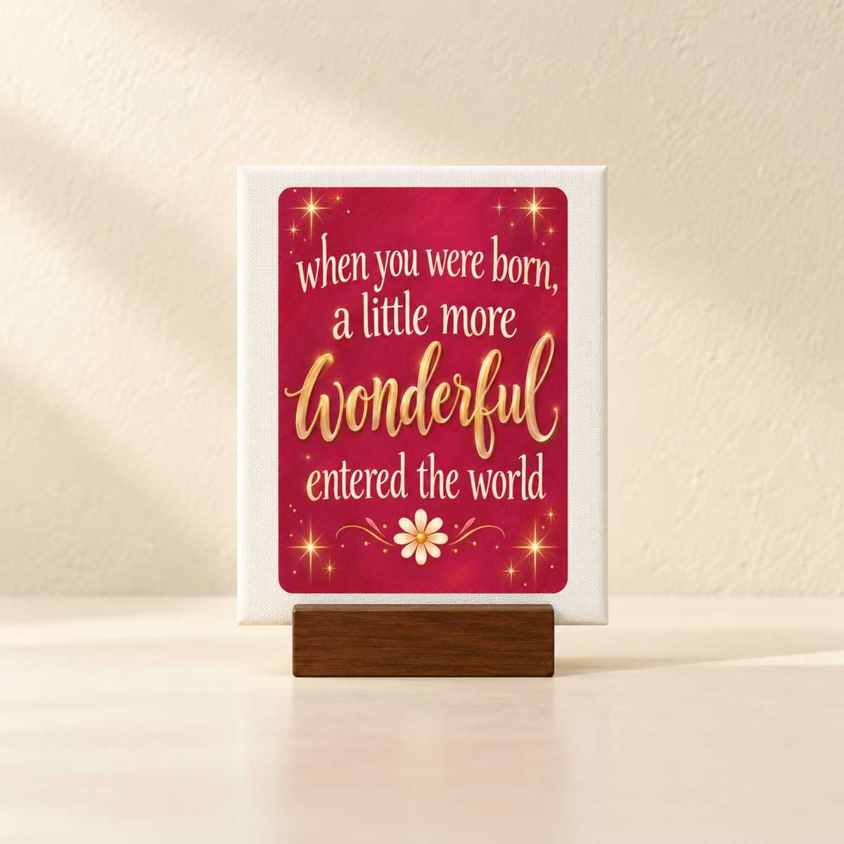 A When You Were Born Friendship Mini Sign on a wooden stand, featuring the quote “When you were born, a little more wonderful entered the world,” with gold stars and a white flower on a red background.