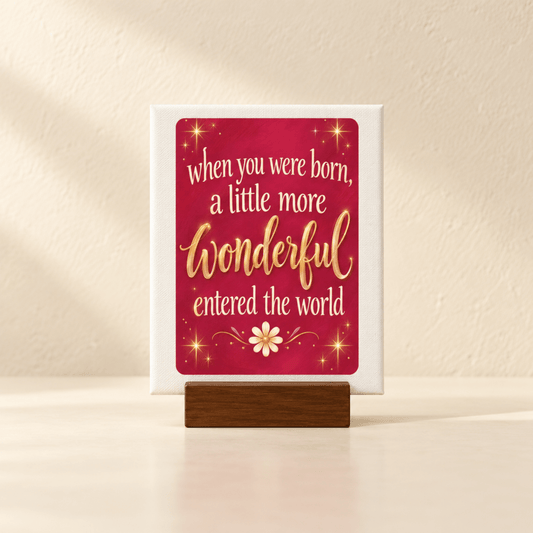 A When You Were Born Friendship Mini Sign on a wooden stand, featuring the quote “When you were born, a little more wonderful entered the world,” with gold stars and a white flower on a red background.