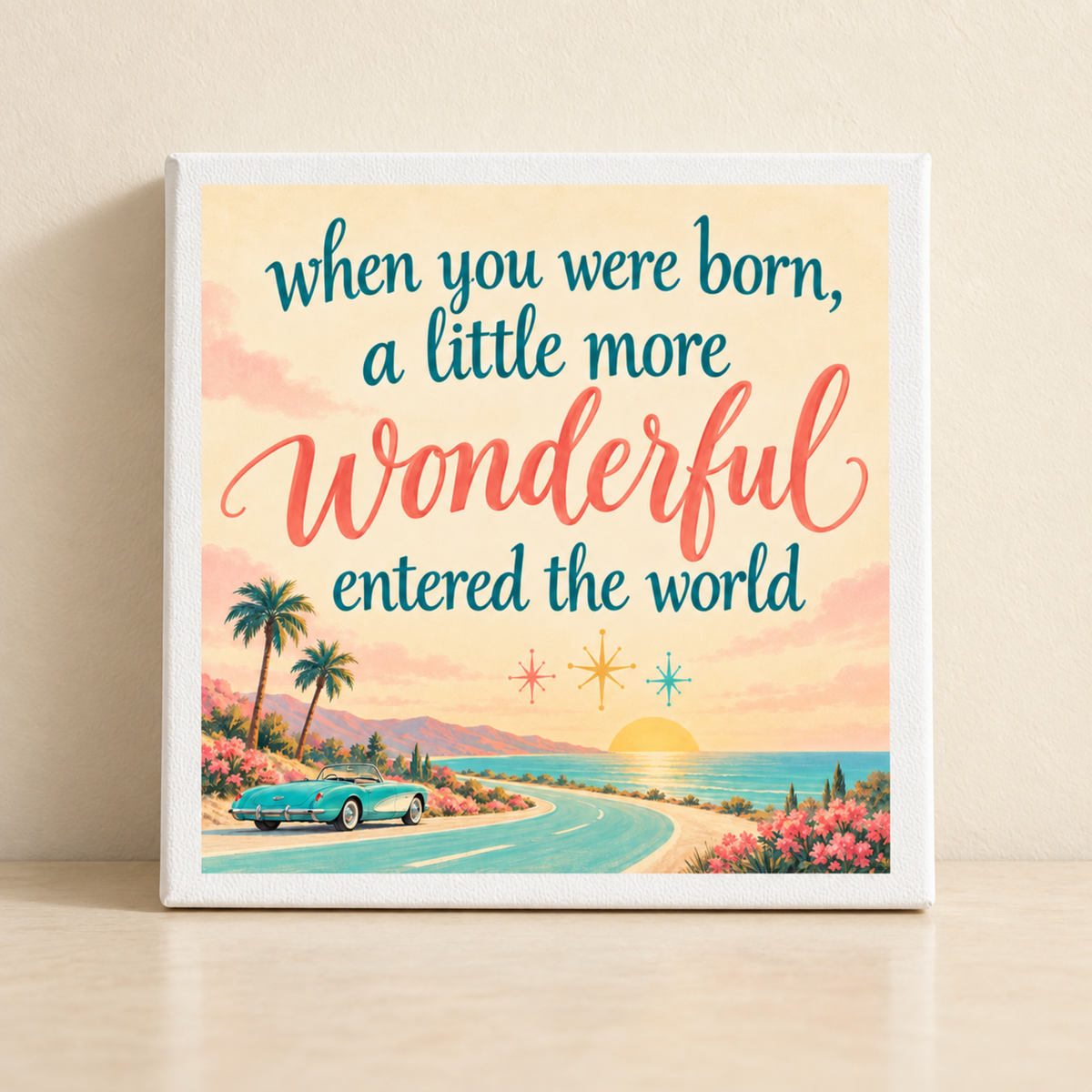 When You Were Born A Little More Wonderful Canvas featuring a teal convertible driving along a coastal road at sunset, with the text “when you were born, a little more Wonderful entered the world.”.