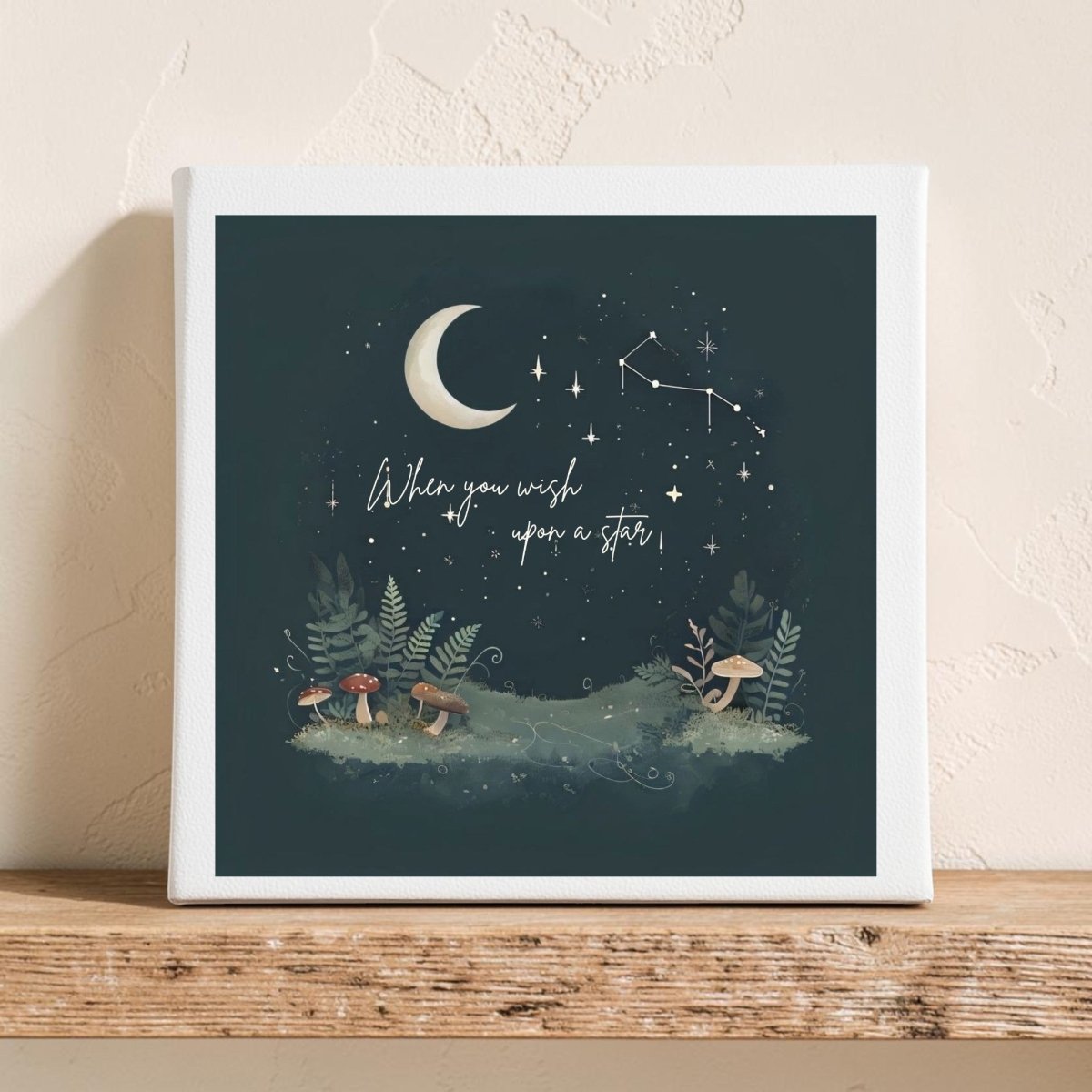 The When You Wish Upon a Star Woodland Canvas by Mirabilia Boutique features a crescent moon, stars, and constellation above mushrooms and ferns, with “When you wish upon a star” in handwritten script—a delightful piece of moon and stars décor that also serves beautifully as woodland nursery wall art.