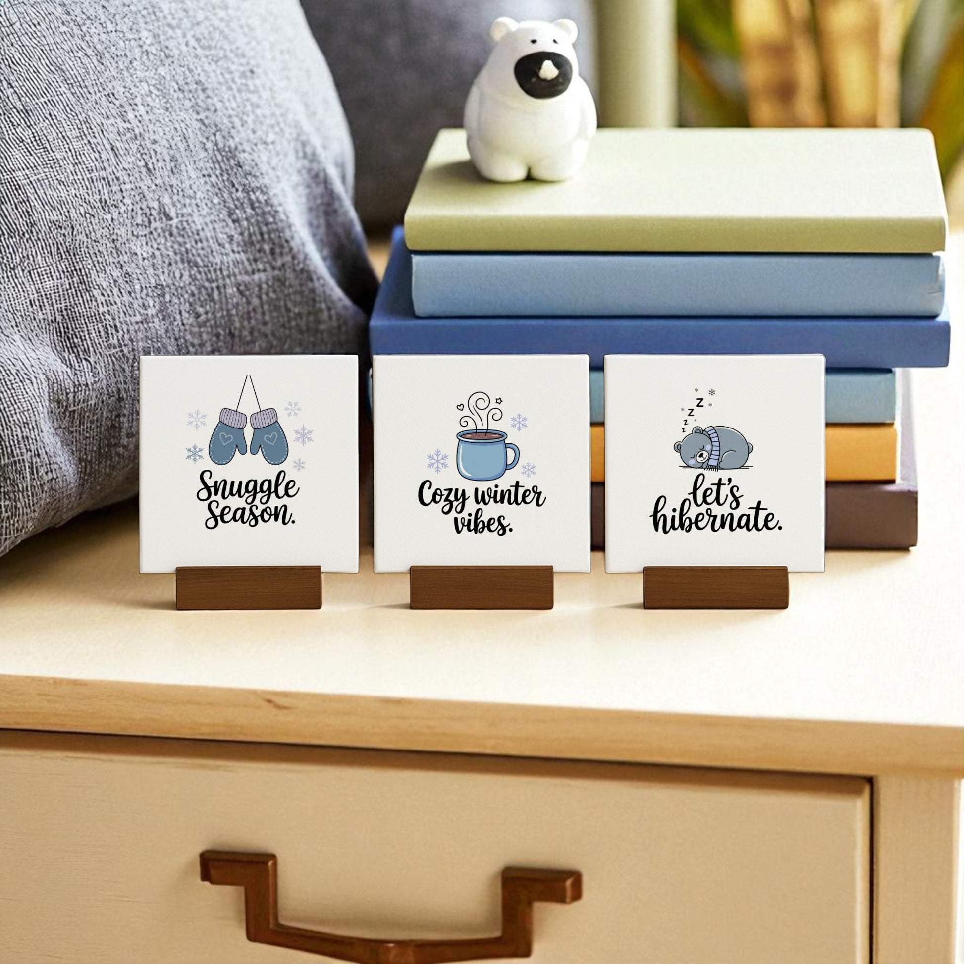 The Mirabilia Boutique Winter Canvas Sign Trio—featuring “Snuggle,” “Cozy Vibes,” and “Hibernate”—adds cozy winter charm to any bedside. This festive decor set makes a perfect seasonal gift, pairing beautifully with books or polar bear figurines.
