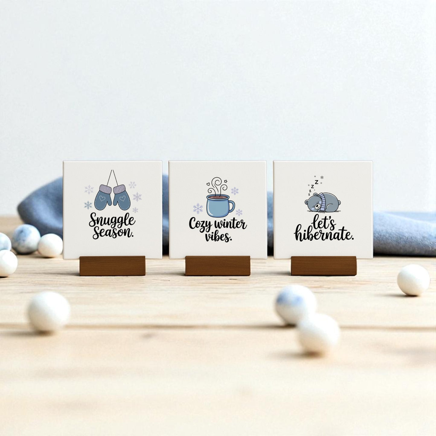 The Mirabilia Boutique Winter Canvas Sign Trio features “Snuggle Season,” “Cozy winter vibes,” and “Let’s hibernate” designs—perfect cozy winter decor for any surface with cute seasonal illustrations.