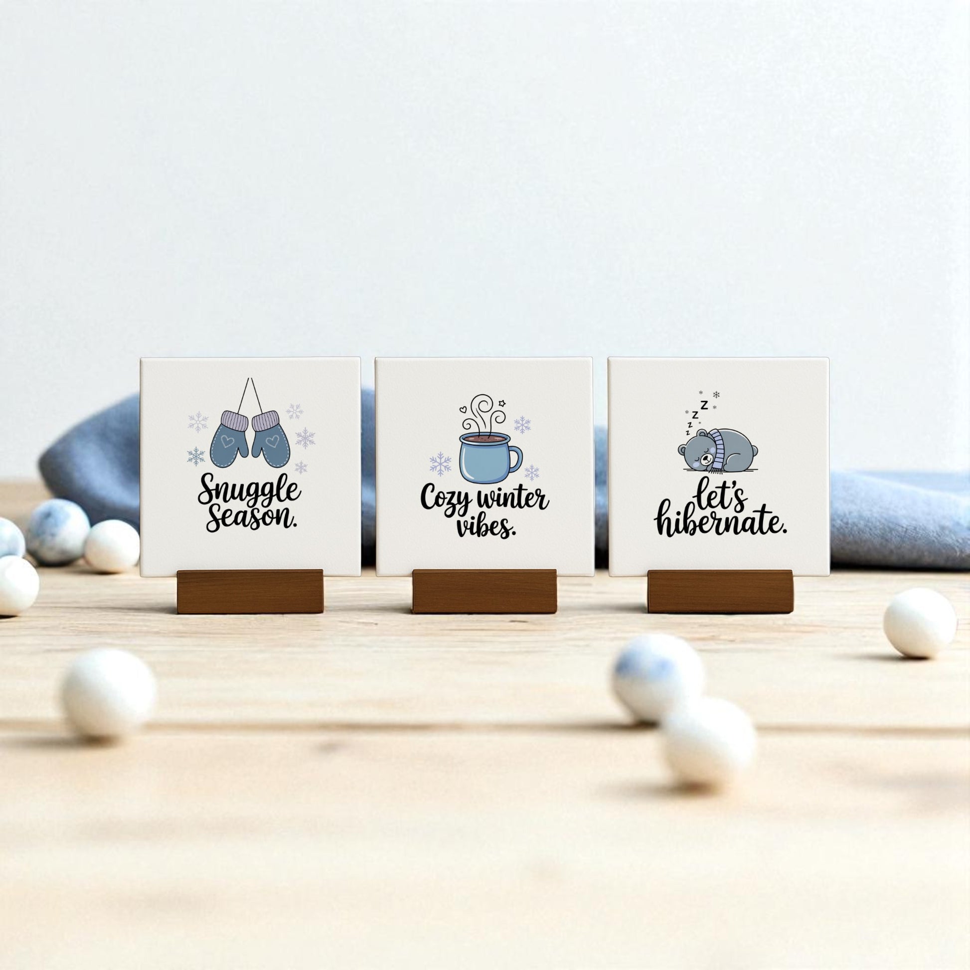 The Mirabilia Boutique Winter Canvas Sign Trio features “Snuggle Season,” “Cozy winter vibes,” and “Let’s hibernate” designs—perfect cozy winter decor for any surface with cute seasonal illustrations.