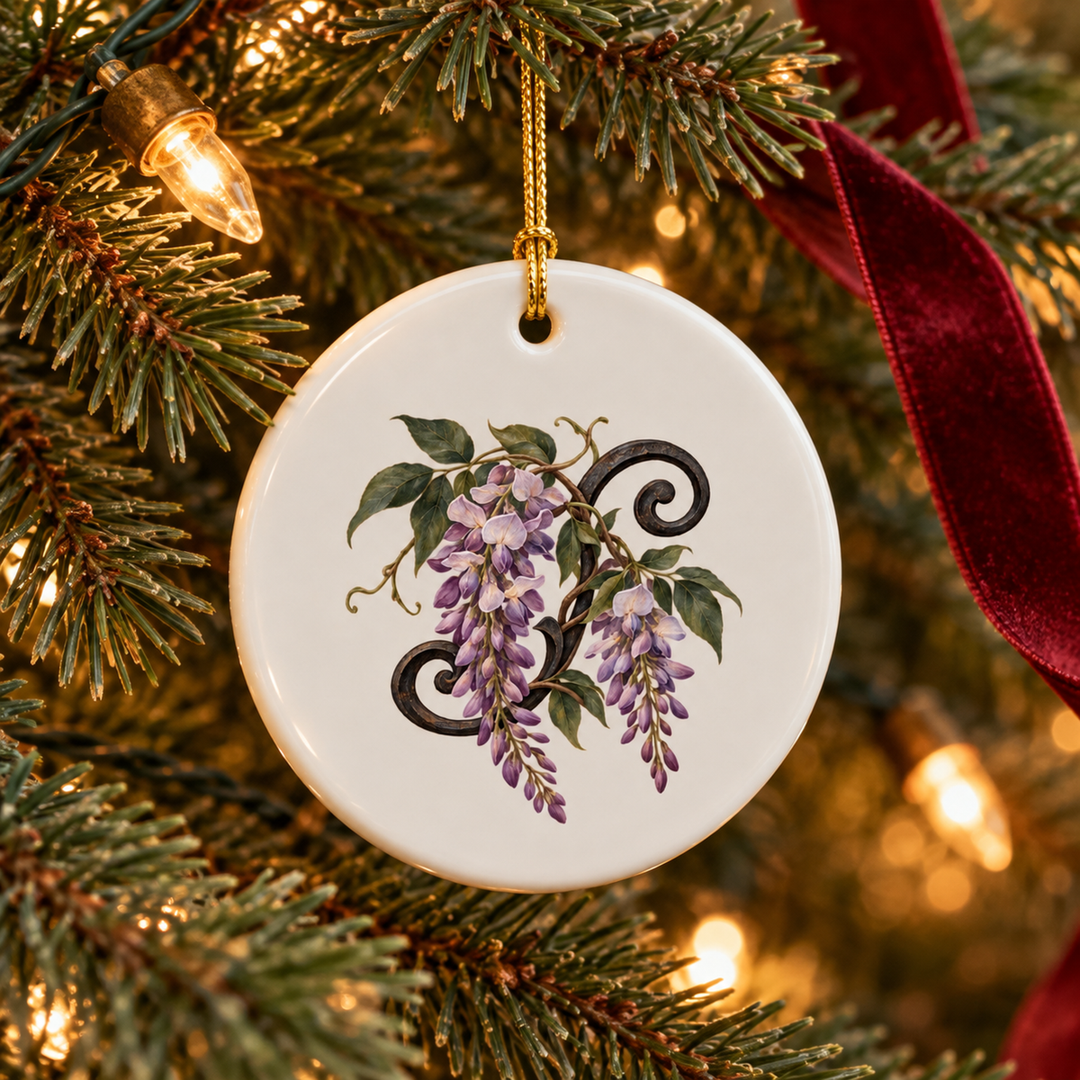 Round white ceramic Wisteria at Blue Hour Ornament featuring a painted illustration of purple wisteria flowers, hanging on a Christmas tree.