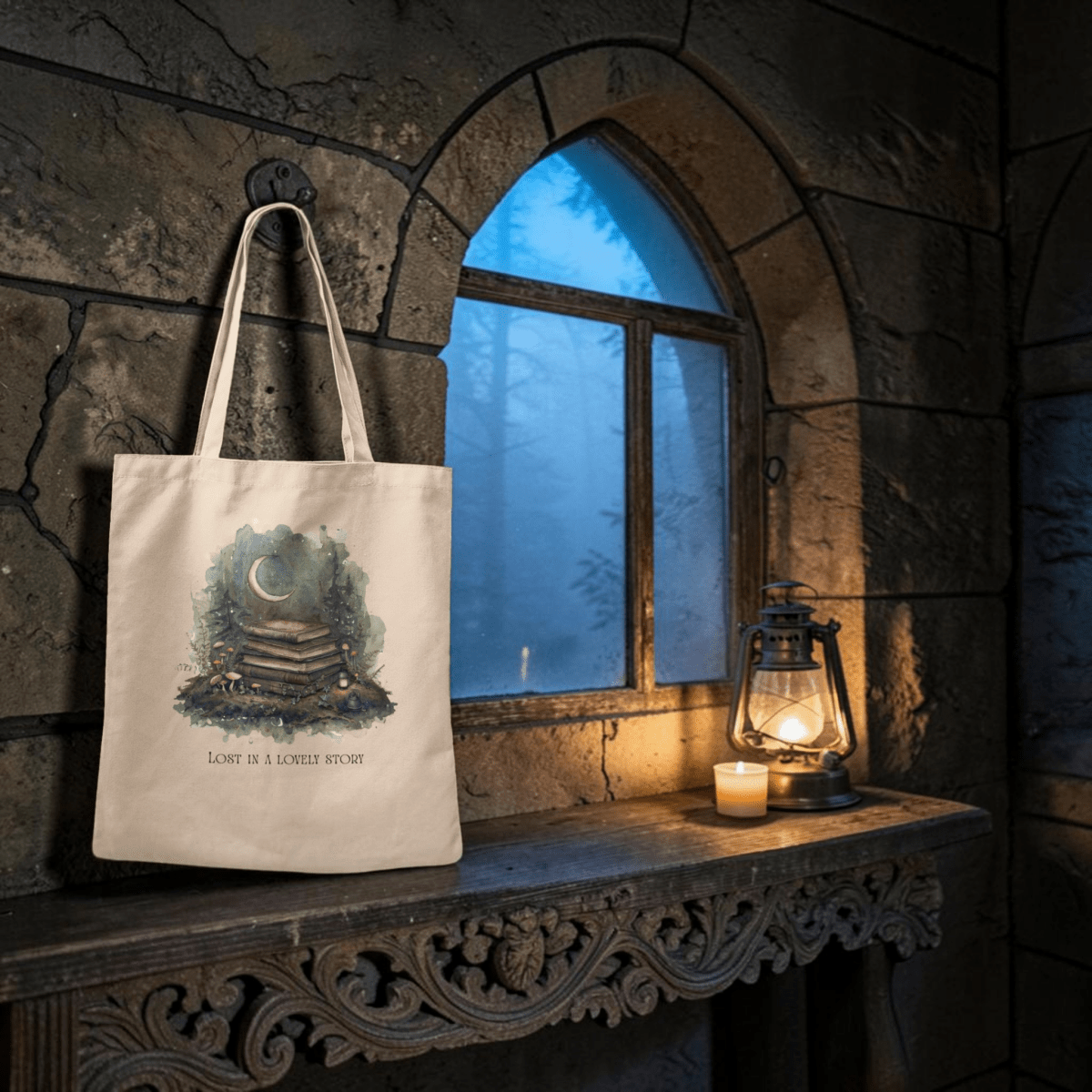 The Lost in a Lovely Story Canvas Tote Bag from Mirabilia Boutique features an enchanting illustration of a crescent moon and stacked books, hanging on a stone wall. Below the artwork, the text reads "Lost in a Lovely Story." Perfect as a literary tote or book lover gift, this charming scene is enhanced by a lantern and candle resting on a carved wooden table beside a gothic window.