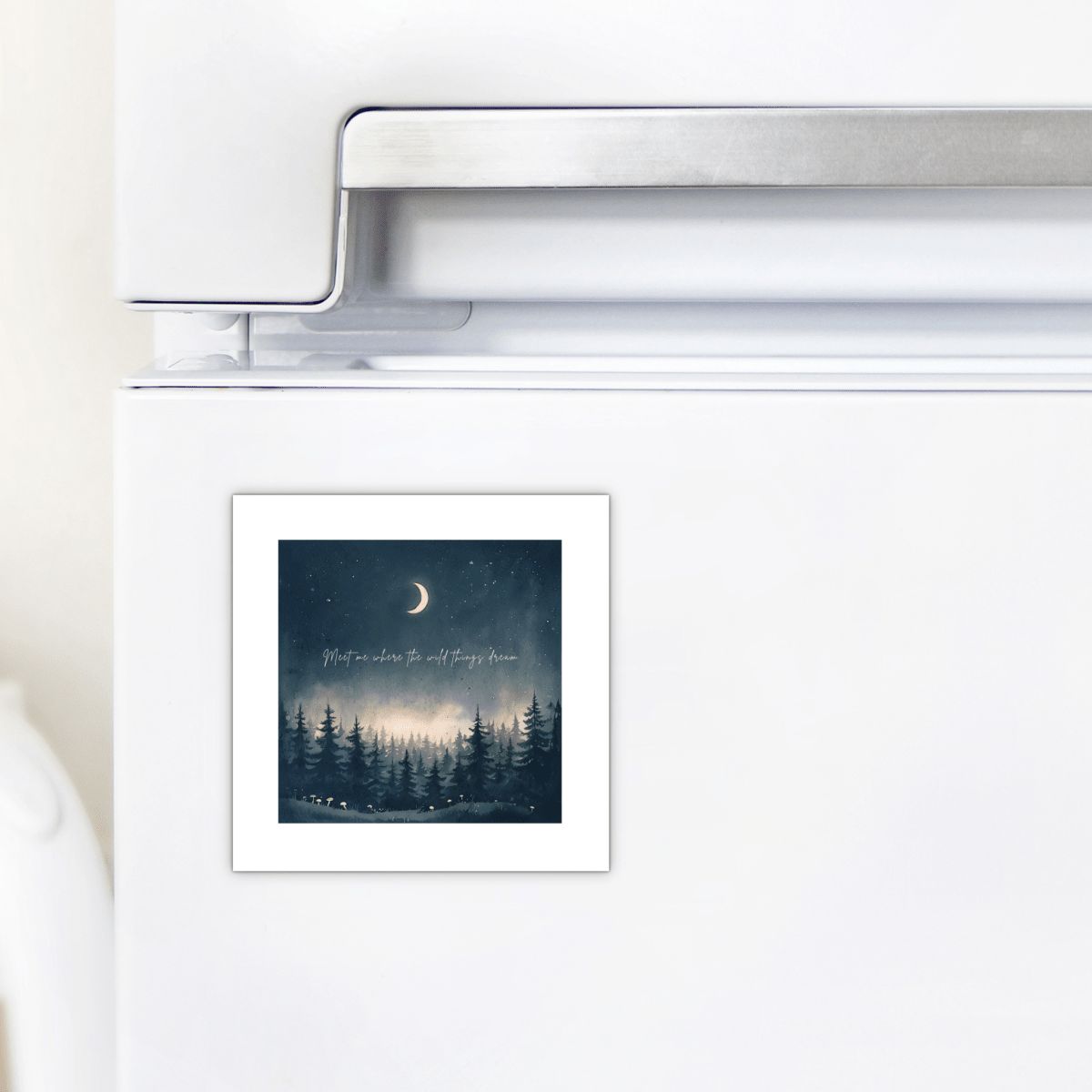 A square "Meet Me Where the Wild Things Dream" magnet by Mirabilia Boutique displays a night woodland scene with a crescent moon, pine trees, and the phrase “Wherever You Go, I’ll Stay Close,” perfect for decorating your refrigerator.
