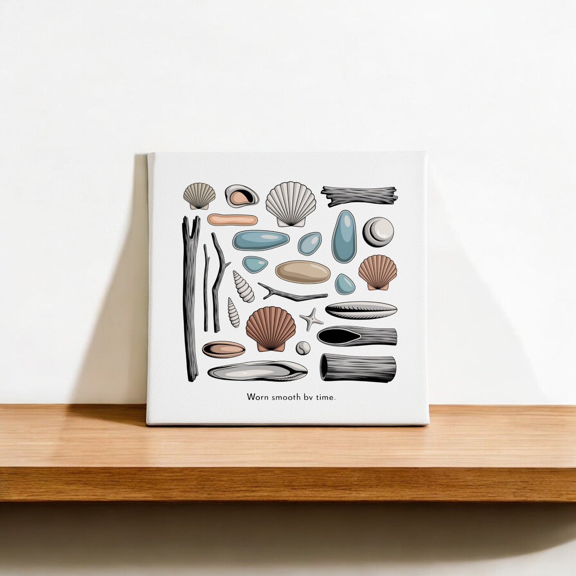The Worn Smooth by Time Canvas by Mirabilia Boutique features illustrated seashells, driftwood, stones, and a starfish in muted tones—perfect minimalist coastal wall art for serene beach-inspired decor.