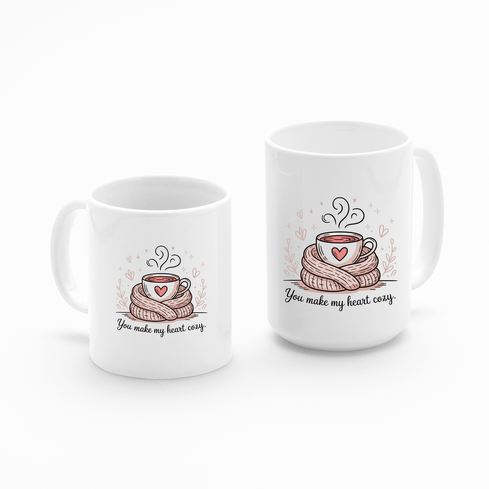 The Mirabilia Boutique "You Make My Heart Cozy" mugs show a steaming cup on a scarf with a heart and the sweet quote “You make my heart cozy”—a cute coffee lover gift, perfect for Valentine’s Day.